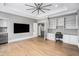 The bonus room has wood floors, custom built-ins, with a desk and mini fridge, perfect for relaxation or work at 3039 Malbec Vly, Acworth, GA 30101