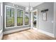 Light-filled breakfast nook featuring large windows, hardwood floors, and a modern chandelier at 3039 Malbec Vly, Acworth, GA 30101