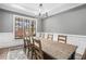 Dining area features a large window offering plenty of natural light, decorative molding, and a gray accent wall at 3039 Malbec Vly, Acworth, GA 30101