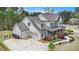 Charming two-story home with a three-car garage, lush landscaping, and an inviting front porch at 3039 Malbec Vly, Acworth, GA 30101