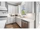Bright white kitchen features stainless steel appliances, plenty of cabinet space, and sleek countertops at 3039 Malbec Vly, Acworth, GA 30101