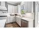 Kitchen features a gas range, stainless steel appliances, quartz counters, and herringbone backsplash at 3039 Malbec Vly, Acworth, GA 30101