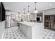 Spacious kitchen with a large kitchen island, stainless steel appliances, and patterned floors at 3039 Malbec Vly, Acworth, GA 30101