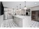 Bright kitchen with granite countertops, a large island, stainless steel appliances, and open shelving at 3039 Malbec Vly, Acworth, GA 30101
