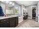 Elegant bathroom featuring double vanities, soaking tub, walk-in shower, and a large window at 3039 Malbec Vly, Acworth, GA 30101
