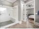 Modern main bathroom featuring a glass-enclosed shower and view into the main bedroom at 3039 Malbec Vly, Acworth, GA 30101
