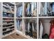 Organized walk-in closet with shelving and racks for clothing, shoes, and accessories at 3039 Malbec Vly, Acworth, GA 30101