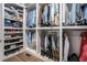 Walk-in closet with custom shelving, hanging rods, and storage for clothing, shoes, and accessories at 3039 Malbec Vly, Acworth, GA 30101
