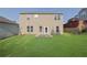 Spacious backyard featuring a well-maintained lawn and a patio, perfect for outdoor activities and entertaining at 679 Barley Hill Ln, Sugar Hill, GA 30518