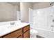 Bathroom featuring a vanity, toilet and shower/tub combo at 679 Barley Hill Ln, Sugar Hill, GA 30518