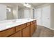 Double vanity sink bathroom with ceramic tile flooring at 679 Barley Hill Ln, Sugar Hill, GA 30518