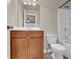 Well-lit bathroom featuring vanity, toilet and tub at 679 Barley Hill Ln, Sugar Hill, GA 30518