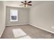 Bedroom with neutral carpet, bright window, and ceiling fan at 679 Barley Hill Ln, Sugar Hill, GA 30518