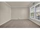 Bedroom featuring neutral walls, carpet, window and white trim at 679 Barley Hill Ln, Sugar Hill, GA 30518