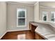 Bright office area with desk and natural light from the windows at 679 Barley Hill Ln, Sugar Hill, GA 30518