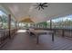 Covered patio with a spacious seating area, providing an ideal spot for outdoor gatherings and relaxation at 679 Barley Hill Ln, Sugar Hill, GA 30518