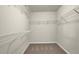 Walk-in closet featuring carpet and multiple shelves at 679 Barley Hill Ln, Sugar Hill, GA 30518