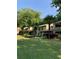 Apartment complex with green lawn, mature trees, and tidy landscaping at 812 Seasons Pkwy, Norcross, GA 30093