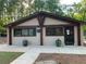 Charming clubhouse with neutral siding, dark trim, and landscaped entryway at 812 Seasons Pkwy, Norcross, GA 30093