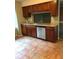 Traditional kitchen with wooden cabinets, granite countertops, and stainless steel dishwasher at 812 Seasons Pkwy, Norcross, GA 30093