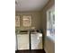 Bright laundry area featuring well-maintained washing machines and natural light at 812 Seasons Pkwy, Norcross, GA 30093