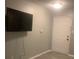 Living room with updated gray plank flooring and a door at 812 Seasons Pkwy, Norcross, GA 30093