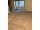 Large living area featuring new neutral carpet and sliding glass doors to a screened-in porch at 812 Seasons Pkwy, Norcross, GA 30093
