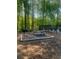Community picnic area surrounded by woods and next to the pool, offering a tranquil setting for outdoor relaxation at 812 Seasons Pkwy, Norcross, GA 30093