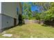 View of the home's backyard and basement door with a wood fence at 2212 Butner Sw Rd, Atlanta, GA 30331