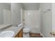 Bathroom featuring neutral walls, vinyl flooring, a bath tub, and a granite-look countertop at 2212 Butner Sw Rd, Atlanta, GA 30331