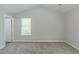 Vaulted bedroom features carpet, a window, and an entrance to another room at 2212 Butner Sw Rd, Atlanta, GA 30331