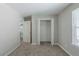 Bedroom with carpet, closet, and entrance to another room with wood flooring at 2212 Butner Sw Rd, Atlanta, GA 30331