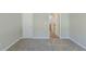 Bright bedroom features carpet and an entrance to another room with wood flooring at 2212 Butner Sw Rd, Atlanta, GA 30331