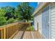 Exterior view of a wooden deck with an entrance door and view of the yard at 2212 Butner Sw Rd, Atlanta, GA 30331