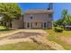 View of the home's backyard showing a 2-story home with a neutral siding and large yard in need of landscaping at 498 Haven Ridge Dr, Stockbridge, GA 30281