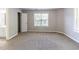 This carpeted bedroom features neutral walls, and a ensuite bathroom at 498 Haven Ridge Dr, Stockbridge, GA 30281