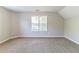 This carpeted bedroom with a window offering plenty of natural light at 498 Haven Ridge Dr, Stockbridge, GA 30281