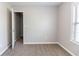 A cozy carpeted bedroom features neutral walls, window and closet at 498 Haven Ridge Dr, Stockbridge, GA 30281