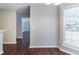 Dining area showcasing hardwood floors, neutral paint, and a bright window overlooking the outdoors at 498 Haven Ridge Dr, Stockbridge, GA 30281