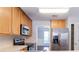 Kitchen featuring stainless steel appliances, wood cabinets, and laminate countertops at 498 Haven Ridge Dr, Stockbridge, GA 30281