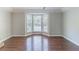 Open living room boasting hardwood floors and a large bay window for lots of natural light at 498 Haven Ridge Dr, Stockbridge, GA 30281