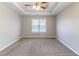 Spacious main bedroom with a tray ceiling and neutral colors, offering a peaceful retreat at 498 Haven Ridge Dr, Stockbridge, GA 30281