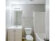 Bathroom features a white vanity, sink, and standard bathtub at 5011 Wewatta Sw St, Atlanta, GA 30331