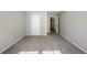 Neutral bedroom with carpeted flooring and fresh, light-colored walls at 5011 Wewatta Sw St, Atlanta, GA 30331