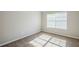 Bedroom with a window, carpet and neutral colored walls at 5011 Wewatta Sw St, Atlanta, GA 30331