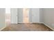 Bedroom with neutral colored walls, carpet and white trim at 5011 Wewatta Sw St, Atlanta, GA 30331