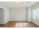 Comfortable bedroom featuring hardwood floors, natural light, and ample space at 5011 Wewatta Sw St, Atlanta, GA 30331