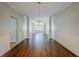 Bright dining room featuring hardwood floors, decorative wainscoting, and a modern chandelier at 5011 Wewatta Sw St, Atlanta, GA 30331