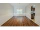 Charming dining area with hardwood floors, decorative molding, and a view into the kitchen at 5011 Wewatta Sw St, Atlanta, GA 30331