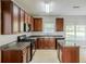 Well-lit kitchen featuring wood cabinets, granite countertops and stainless steel appliances at 5011 Wewatta Sw St, Atlanta, GA 30331